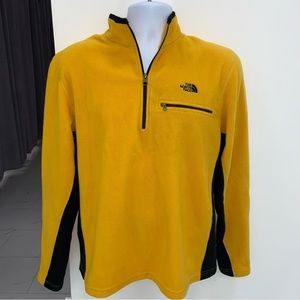 The North Face fleece pullover in goldenrod with black trim. Big Breast pocket.